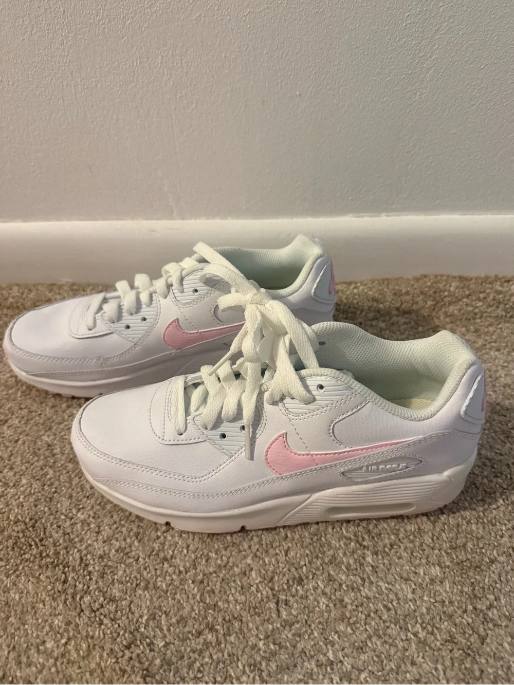 Nike Kids White Sneakers with Pink Swoosh Accent